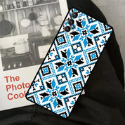 Ukrainian pattern phone case for Samsung Galaxy with blue and black ornament design displayed on a book with kitchen images.