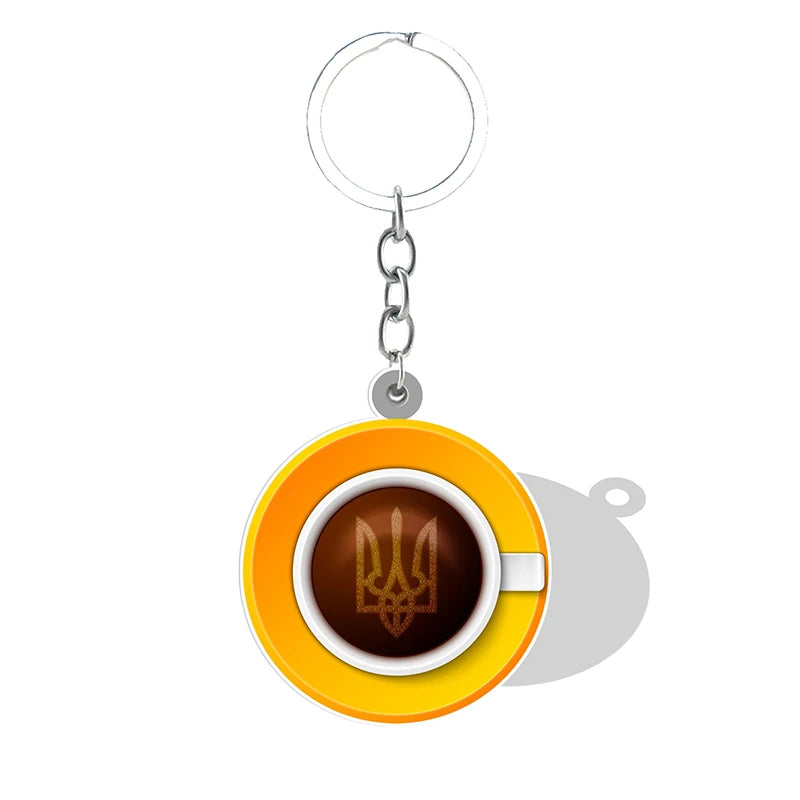 Ukrainian Trident symbol pendant keychain in yellow and white cup design, acrylic keychain for heritage pride and unity.
