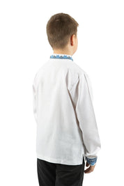 Boy wearing a white linen shirt with blue Ukrainian embroidery, viewed from the back, suitable for ages 5-16.