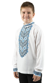 Boy wearing Ukrainian white linen shirt with blue embroidery, ages 5–16, traditional ethnic design for cultural and festive occasions.