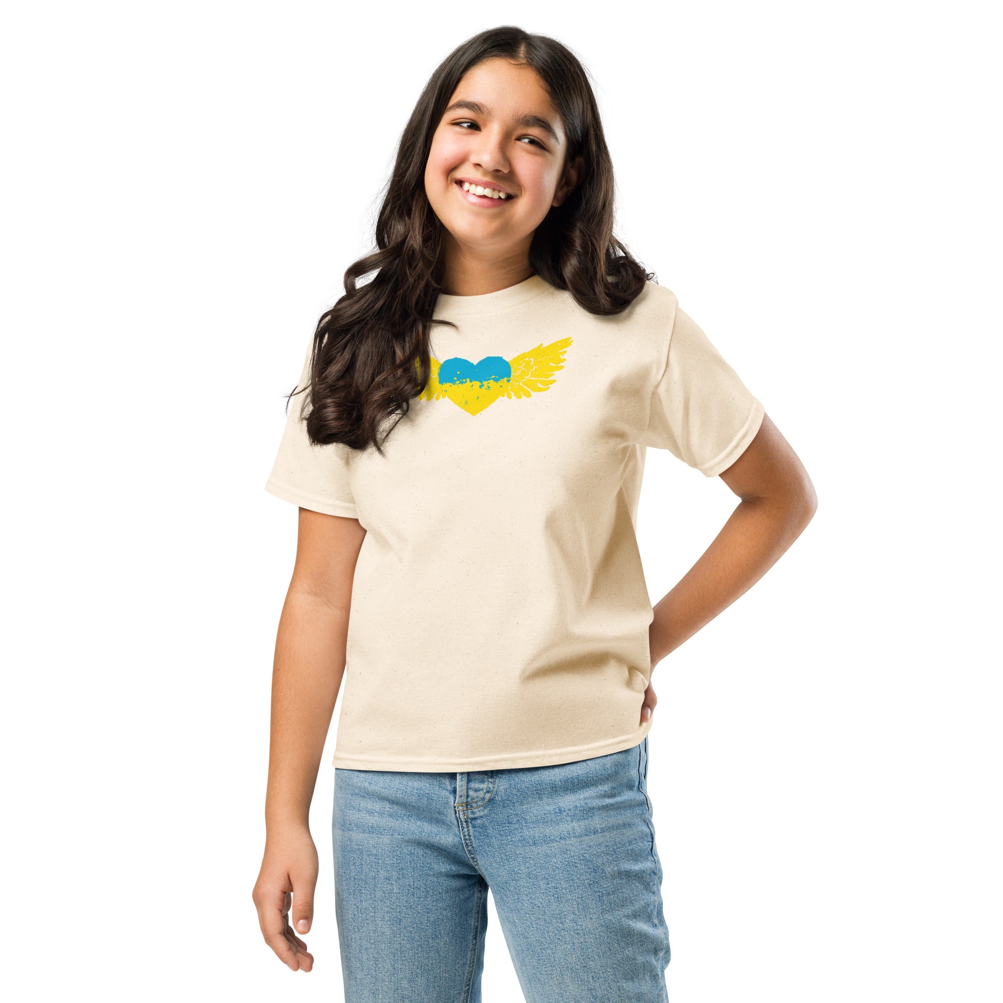 Smiling girl wearing a youth classic T-shirt with Ukrainian Tryzub emblem in blue and yellow, symbolizing Ukrainian pride and culture.