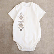 Ukrainian embroidered baby romper with beige-brown patterns, Vyshyvanka style, perfect for newborns and baby shower gifts.
