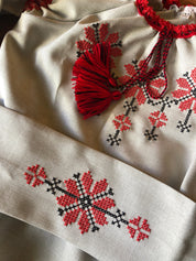 Ukrainian embroidered linen dress for girls with red Rosava motif and belt, showcasing traditional style and intricate floral design.