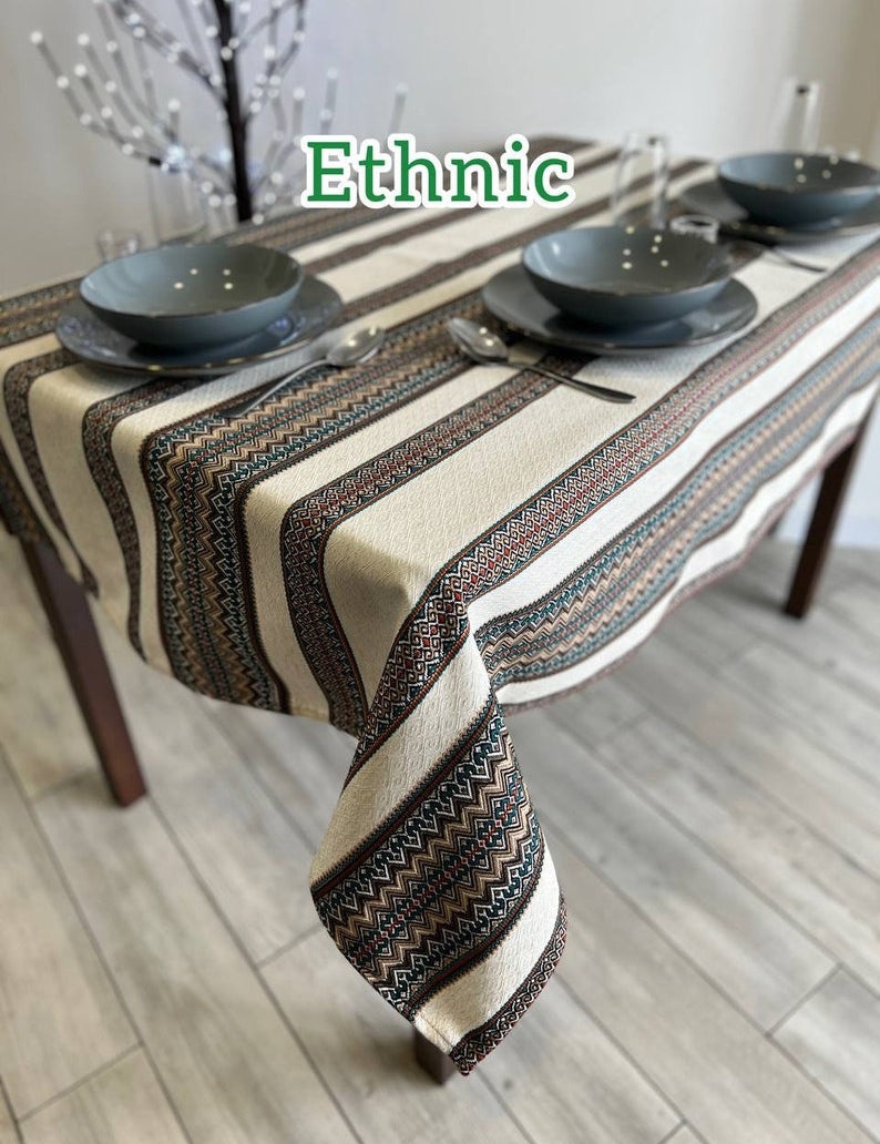 Ukrainian embroidered linen tablecloth with ethnic patterns on rectangular dining table.