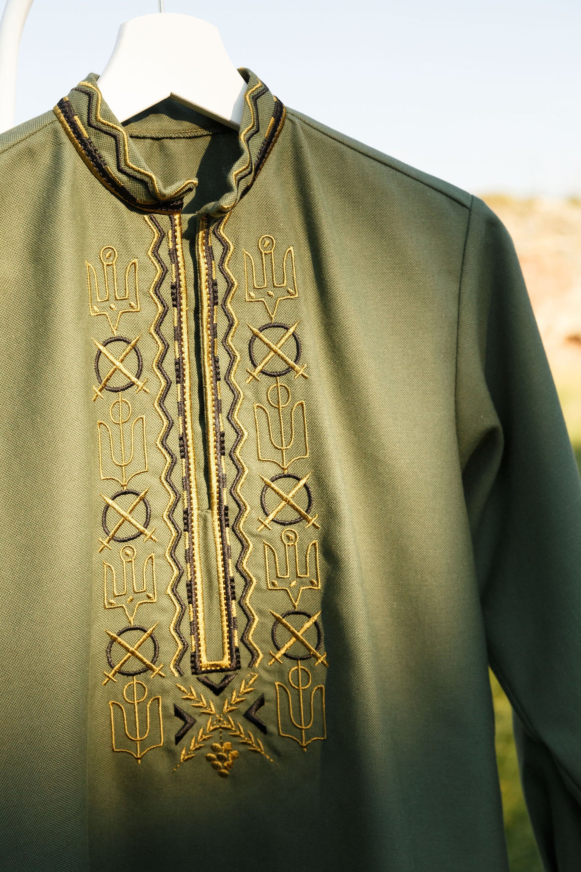 Ukrainian embroidered Vyshyvanka for men, military-style shirt, handmade cotton, inspired by cultural heritage and contemporary style.