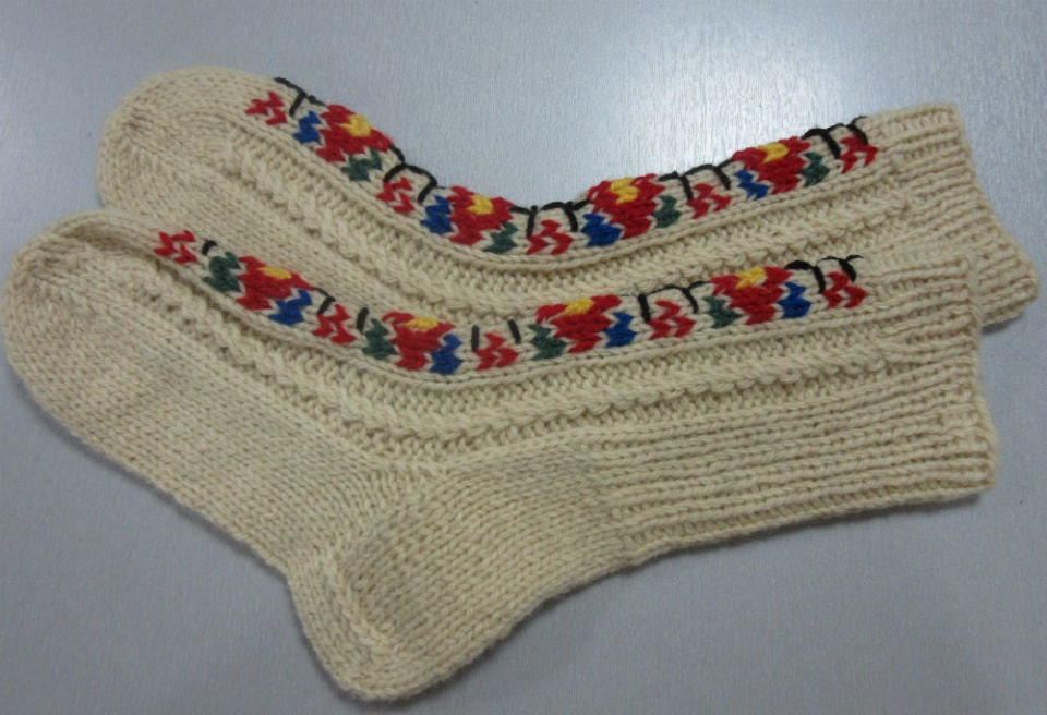 Handcrafted folklore knitted wool socks with colorful embroidery, cozy gift for men and women, perfect for winter warmth.