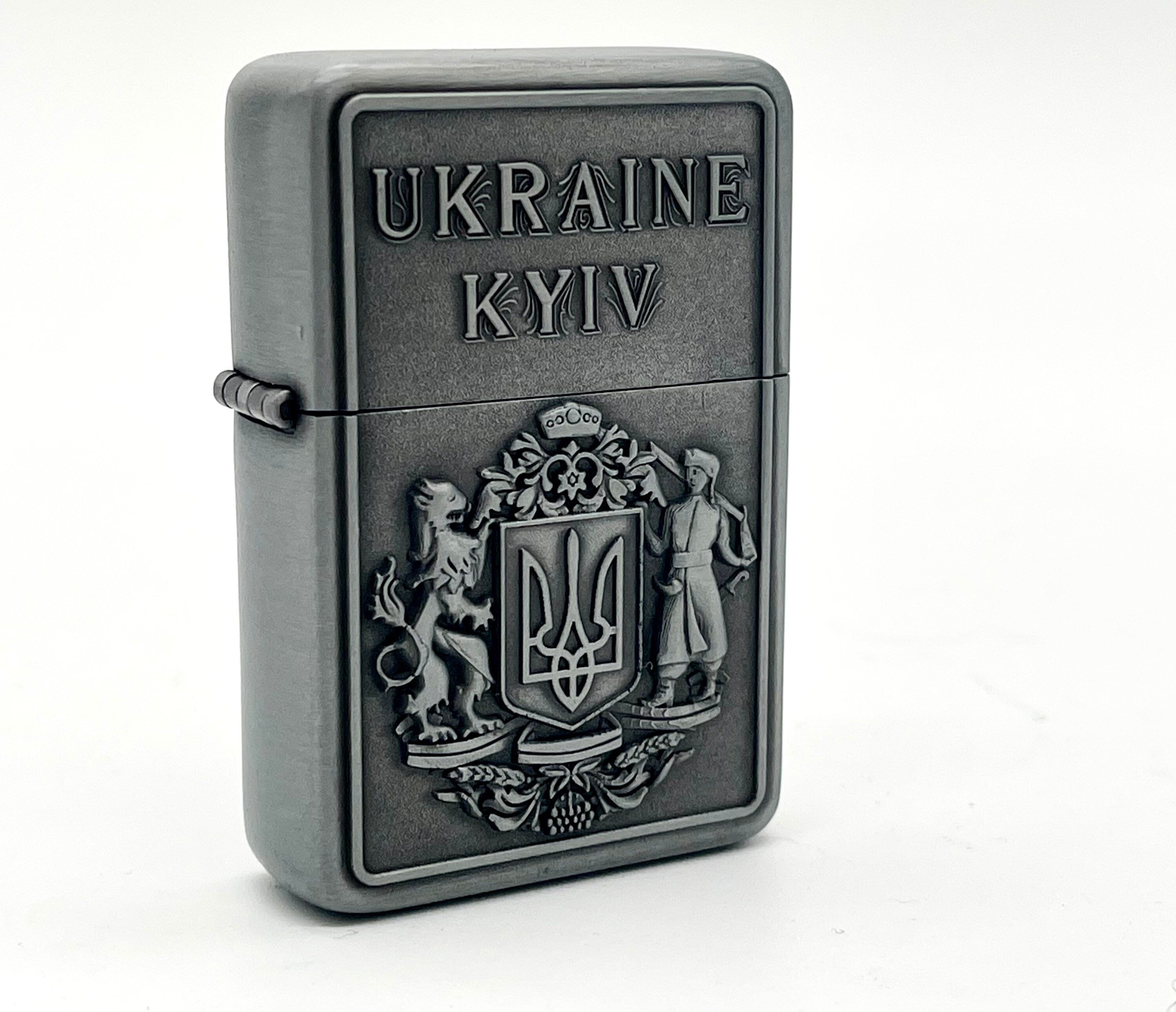 Ukrainian gasoline lighter with bronze and silver national symbol, featuring the Kyiv Coat of Arms, collectible design.