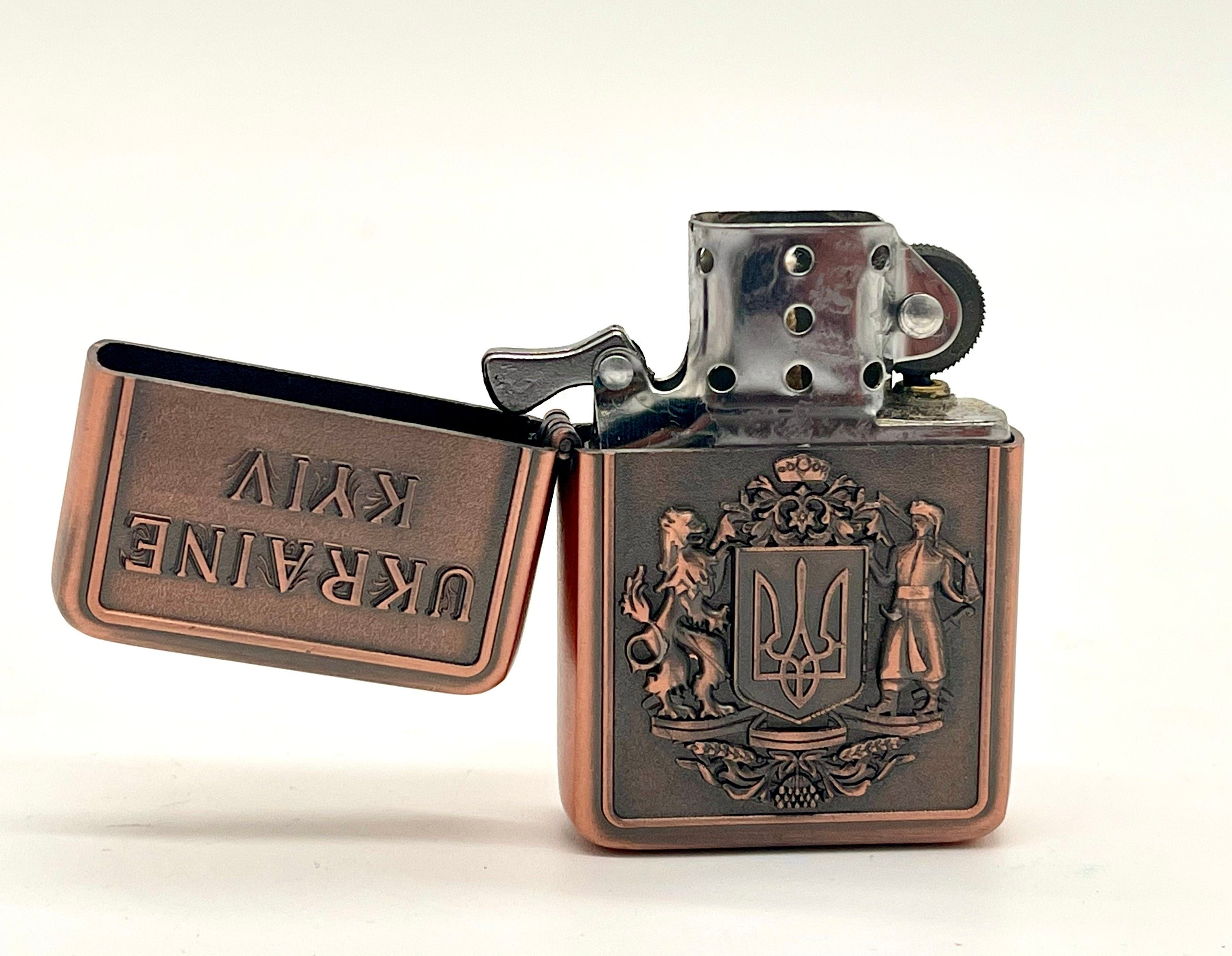 Ukrainian gasoline lighter with bronze and silver coat of arms, featuring national symbols. Perfect for collectors and everyday use.