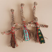 Handmade miniature Motanka dolls crafted from jute twine, showcasing traditional Ukrainian folk art and vibrant patterns.