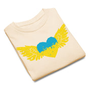 Folded youth classic t-shirt featuring a blue and yellow heart with wings design, symbolizing Ukrainian pride and culture.