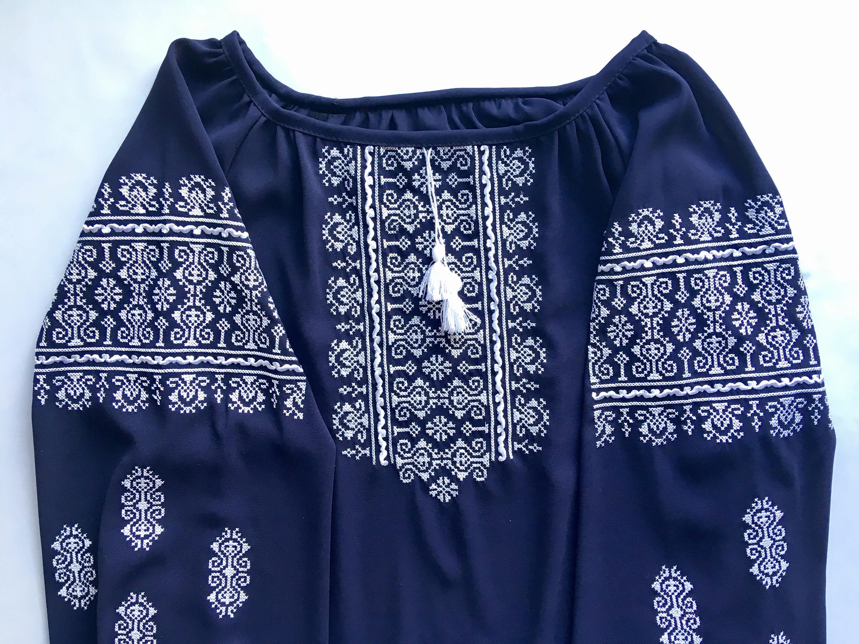 Marsala boho Vyshyvanka blouse with white geometric embroidery on dark fabric, showcasing Ukrainian peasant shirt style.