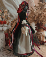 Handmade Ukrainian Motanka Doll with traditional Slavic attire and floral headdress, symbolizing protection and cultural heritage.