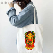 Woman carrying Ukrainian Patriotic Grocery Tote Bag with vibrant cultural design in colorful print