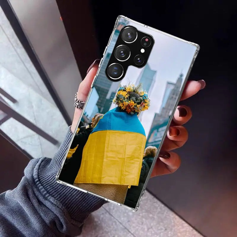 Ukrainian patriotic silicone phone case for Samsung Galaxy with floral design showcased on a hand, offering style and protection.