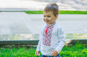 Toddler wearing Ukrainian embroidered vyshyvanka shirt, ideal for cultural events and holidays, showcasing traditional design.