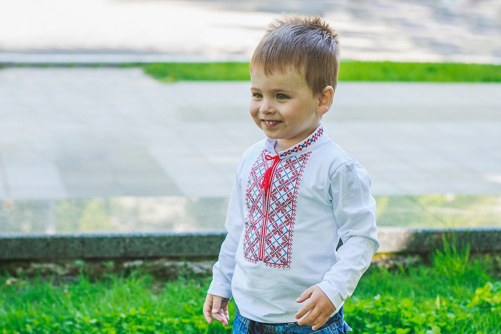 Toddler wearing Ukrainian embroidered vyshyvanka shirt, ideal for cultural events and holidays, showcasing traditional design.