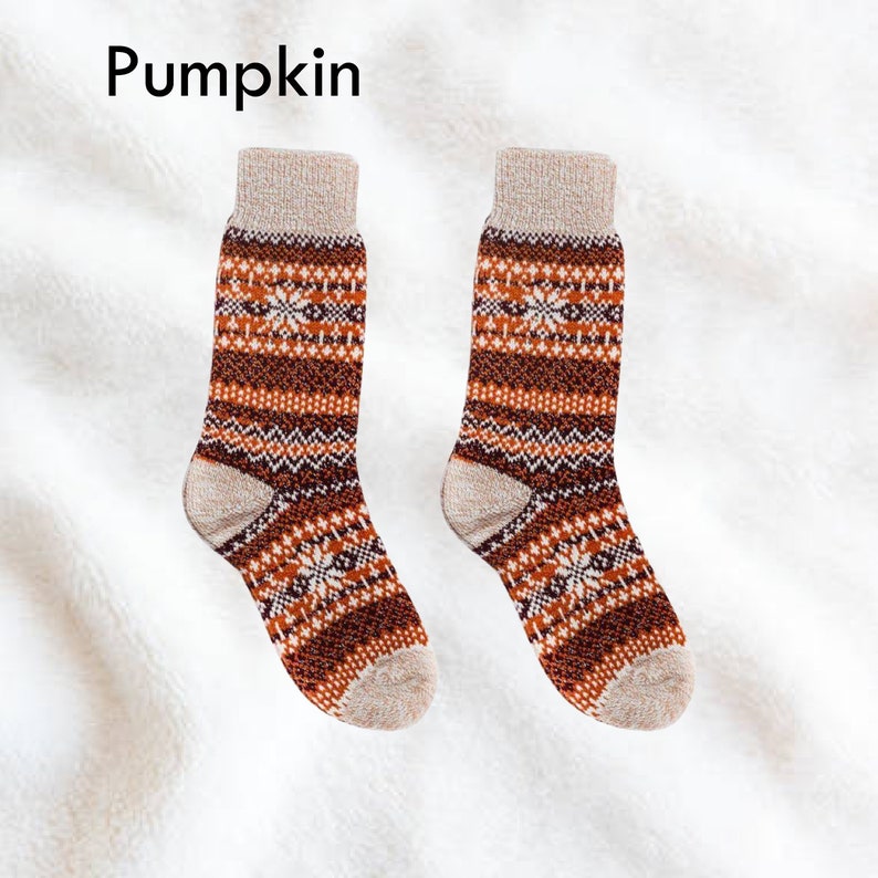 Cozy Scandinavian-inspired wool socks with pumpkin color pattern, perfect for winter warmth and style.