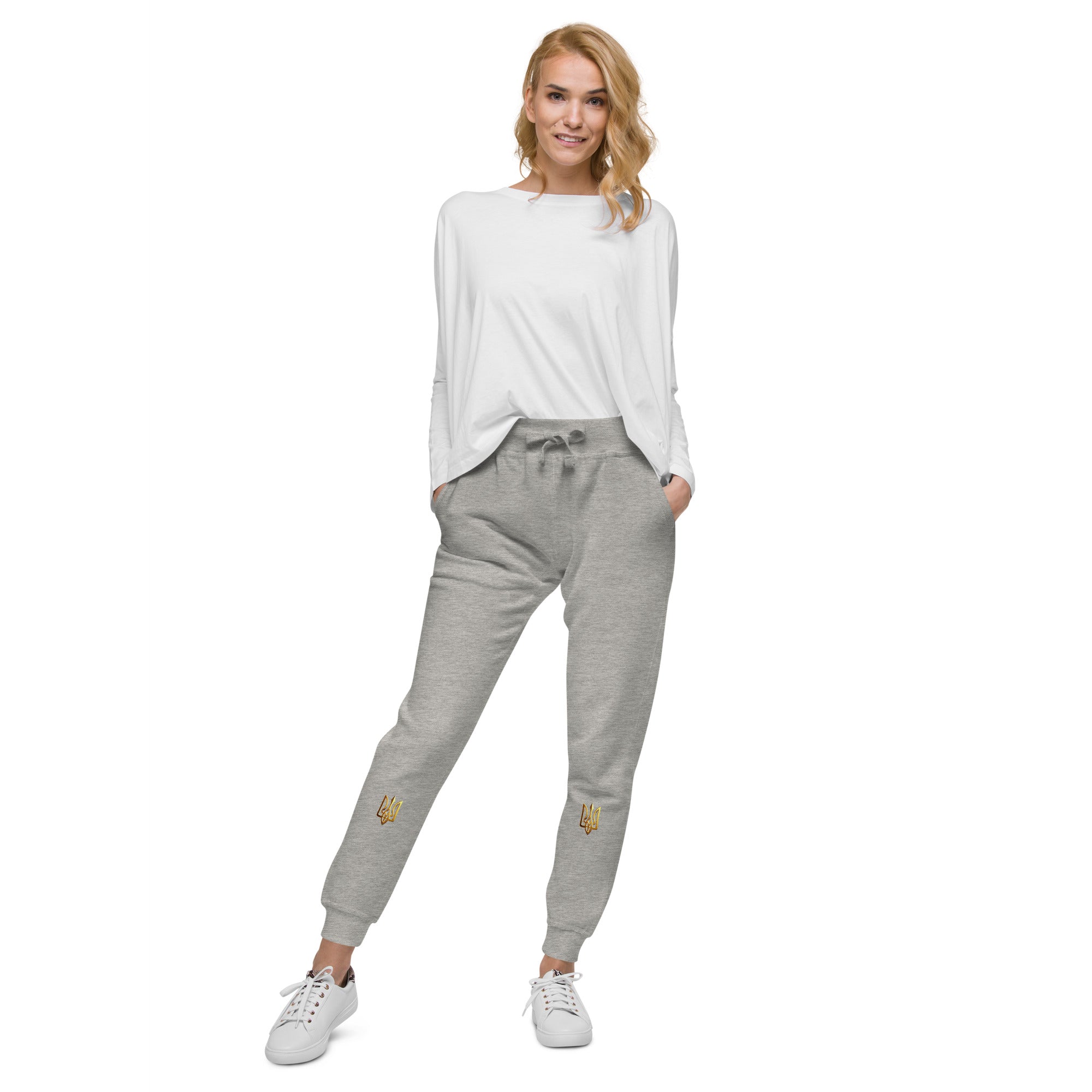 Unisex fleece sweatpants from Ukrainian Vibe Trizub Collection, featuring a cozy fit and stylish design, worn by a person with a white top.