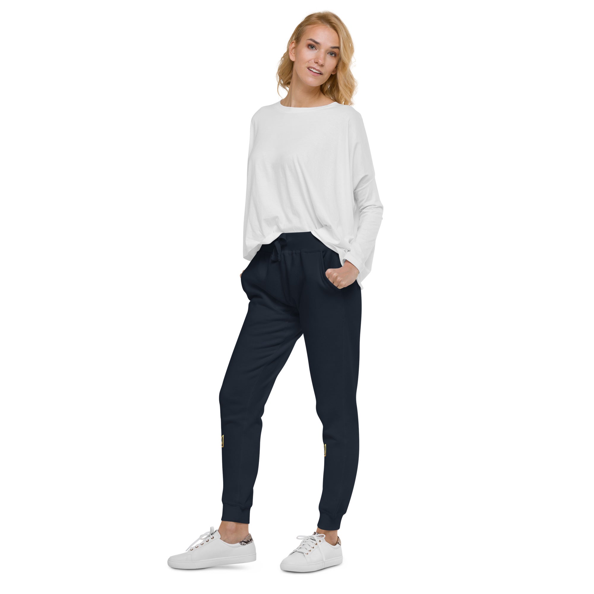 Woman wearing Ukrainian Vibe Trizub unisex fleece sweatpants in a casual outfit with sneakers.