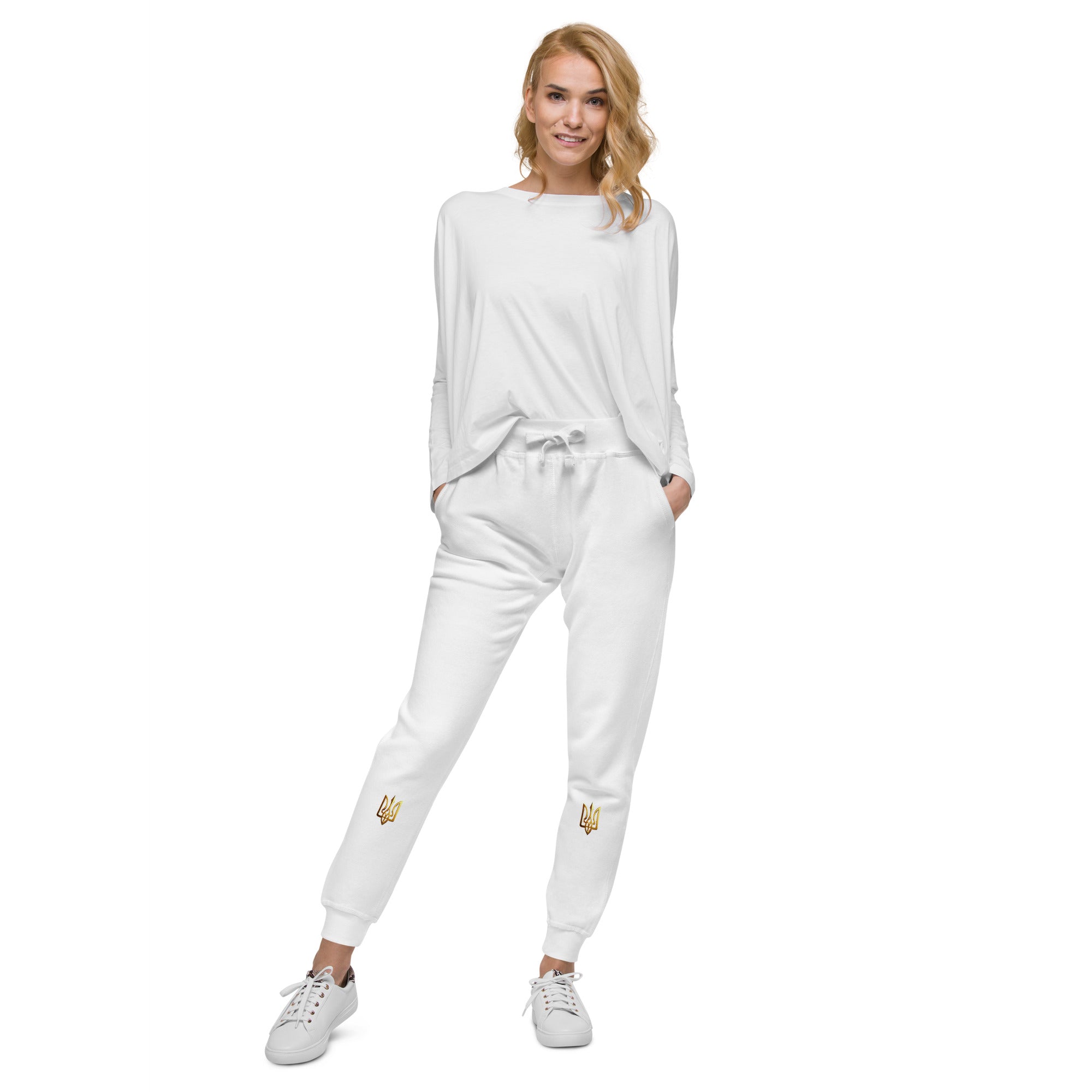 Model wearing Ukrainian Vibe Trizub Collection unisex fleece sweatpants, showcasing comfort and style with embroidered Trizub emblem.