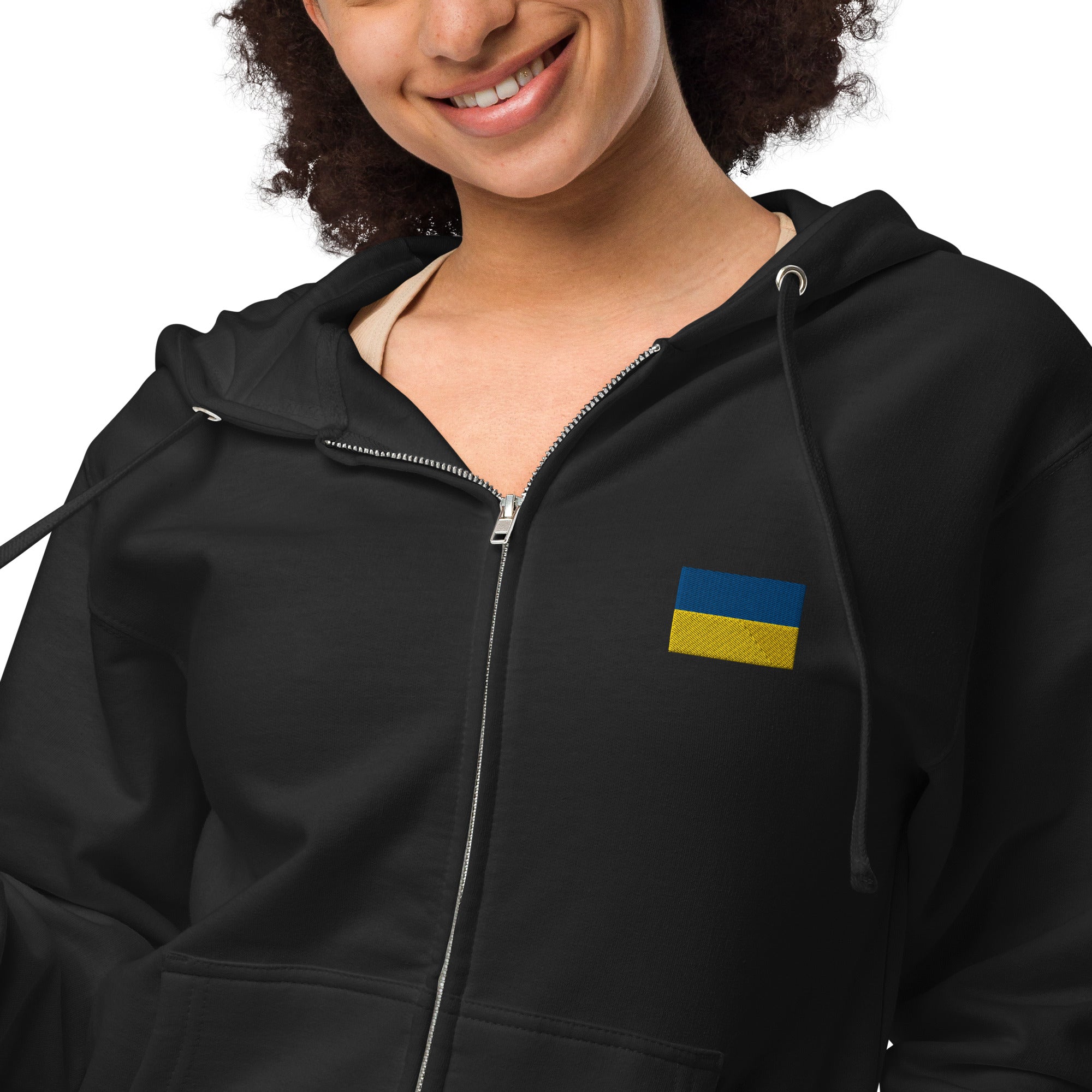Woman wearing Ukrainian Flag fleece zip-up hoodie from the Ukrainian Vibe Trizub Collection, showcasing patriotic style.