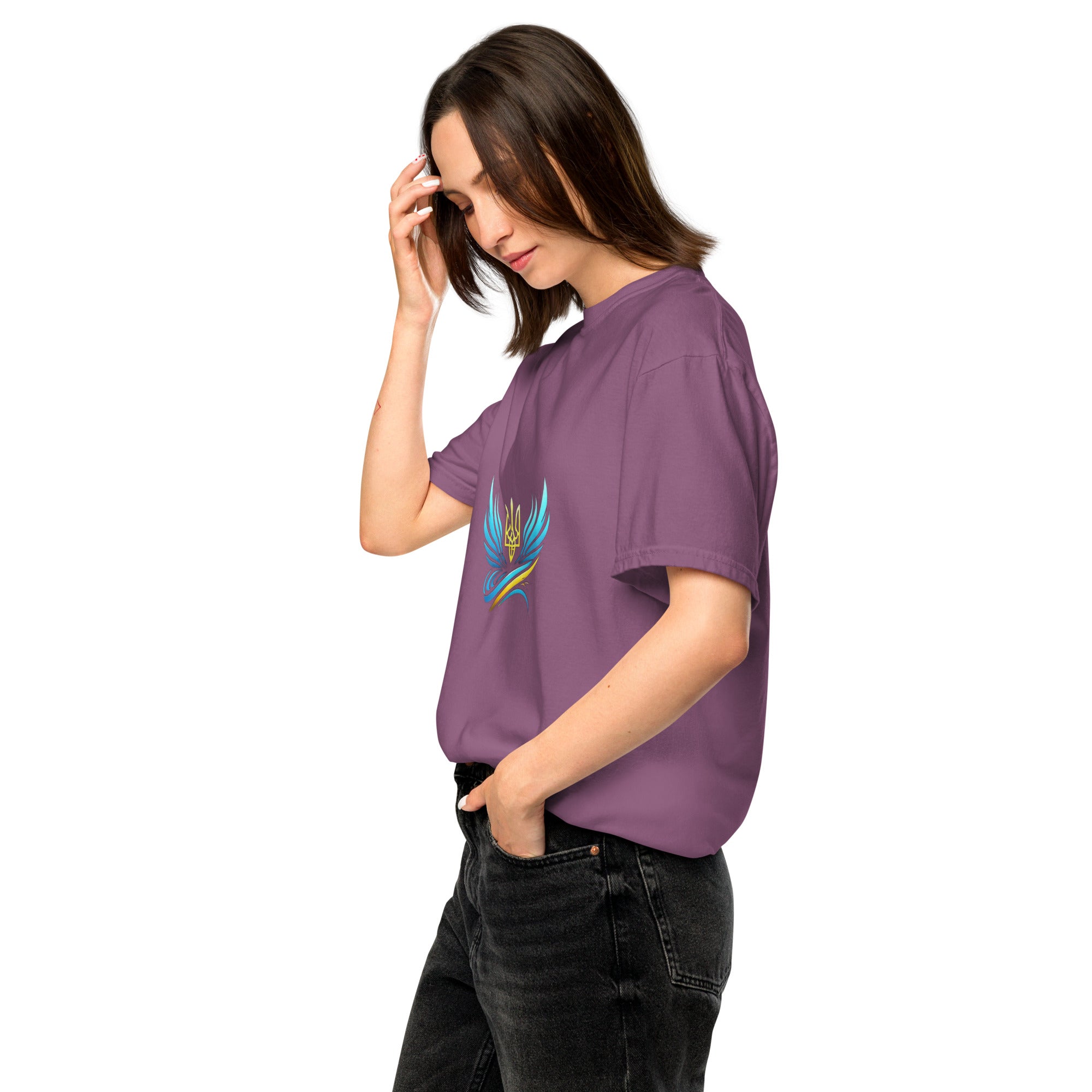 Woman wearing Ukrainian Vibe Trizub Collection purple heavyweight t-shirt with a trident design, side pose, casual outfit