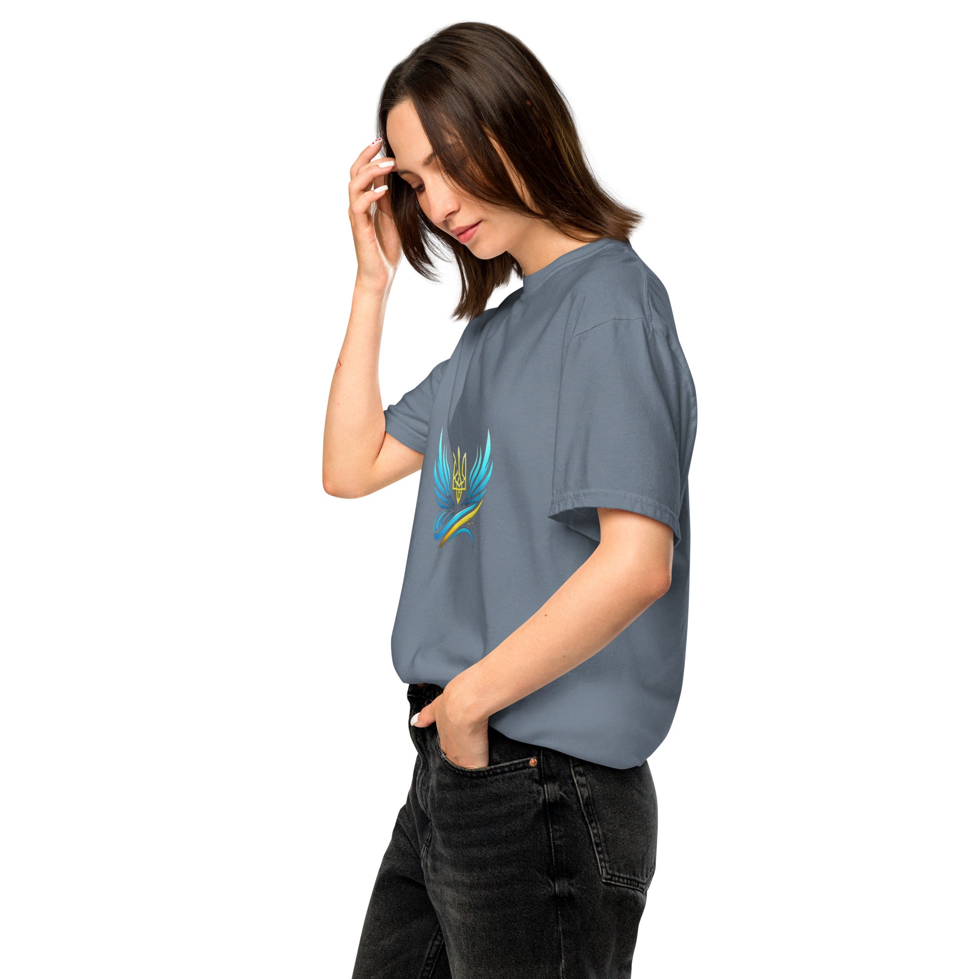 Woman wearing Ukrainian Vibe Trizub Collection heavyweight t-shirt, featuring a garment-dyed finish and relaxed fit, side view.