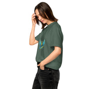 Woman wearing Ukrainian Vibe Trizub Collection garment-dyed heavyweight t-shirt, forest green, 100% cotton, side view.
