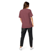 Back view of woman wearing Ukrainian Vibe Trizub Collection garment-dyed heavyweight t-shirt in burgundy, casual fit.