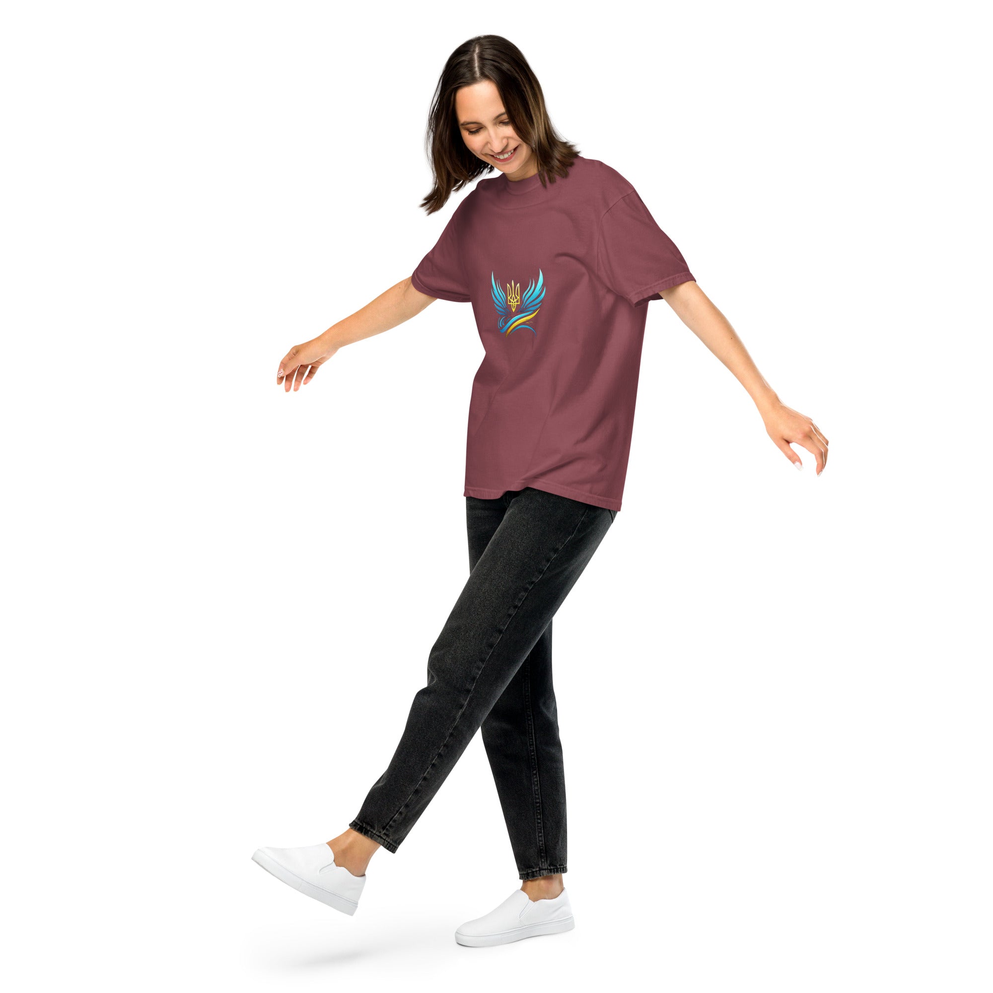 Woman wearing Ukrainian Vibe Trizub Collection garment-dyed t-shirt with embroidered trident design, casual fit.