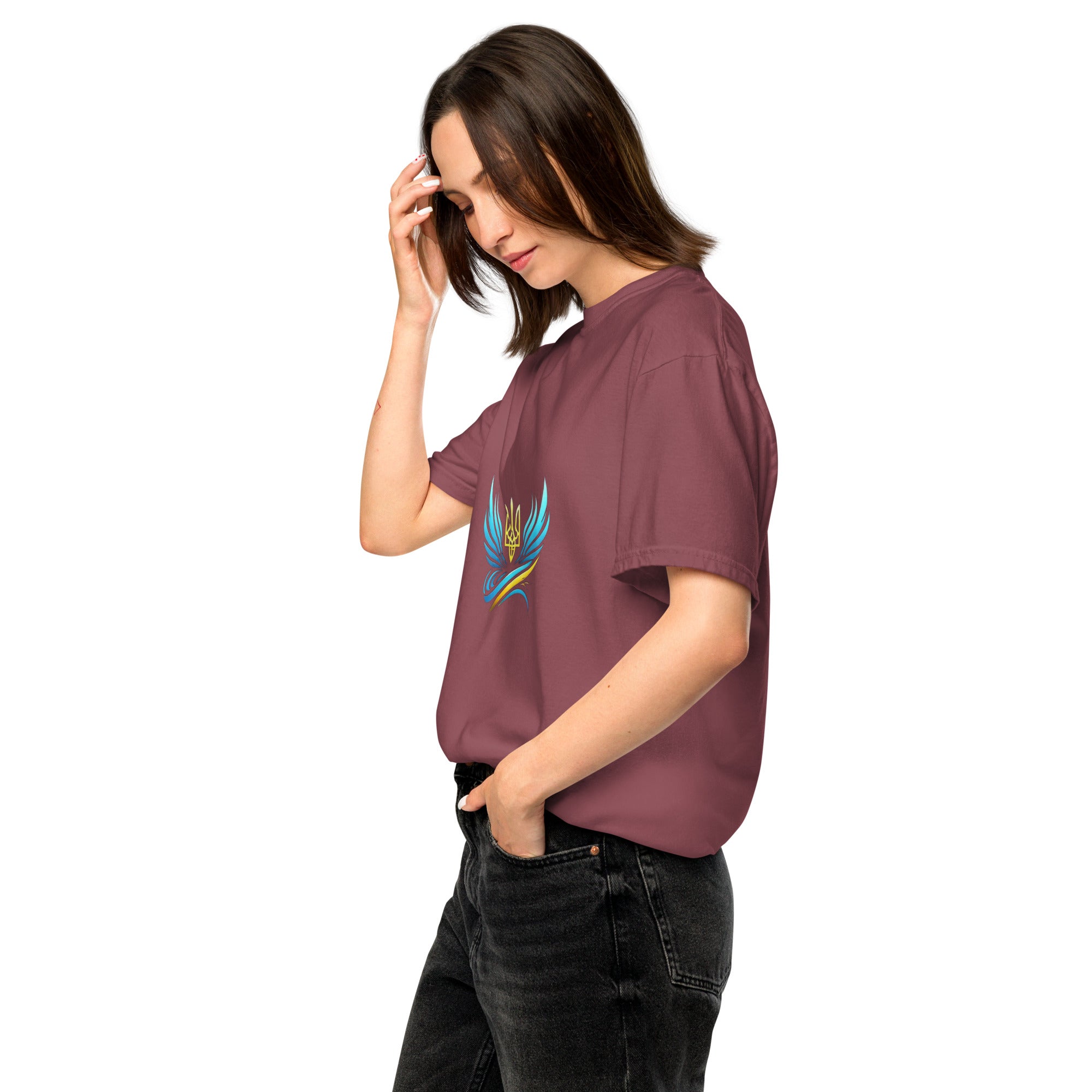 Woman wearing Ukrainian Vibe Trizub collection garment-dyed heavyweight t-shirt with trident design, side profile view.