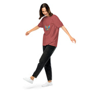 Woman wearing a relaxed fit, garment-dyed Ukrainian Vibe Trizub Collection t-shirt, 100% cotton, with embroidered design, paired with black jeans.
