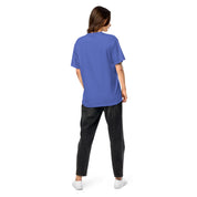 Woman wearing Ukrainian Vibe Trizub heavy cotton t-shirt, back view, showcasing garment-dyed finish and relaxed fit in blue.