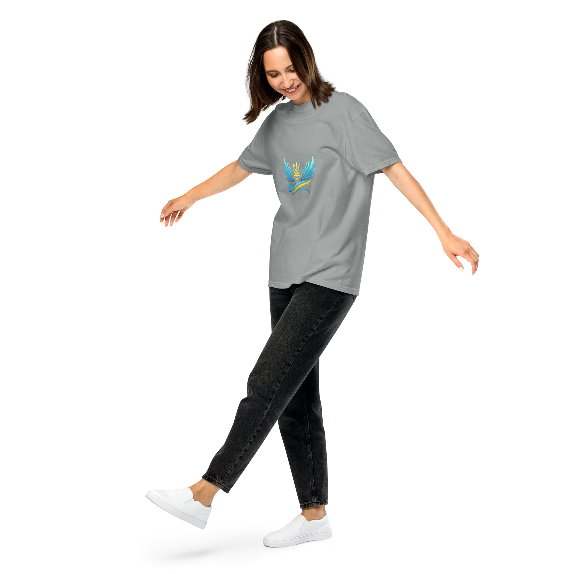 Woman wearing Ukrainian Vibe Trizub Collection garment-dyed tee, featuring heavyweight cotton and relaxed fit, walking casually.