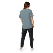 Woman wearing Ukrainian Vibe Trizub Collection garment-dyed heavyweight t-shirt. Back view of relaxed fit, 100% cotton tee.