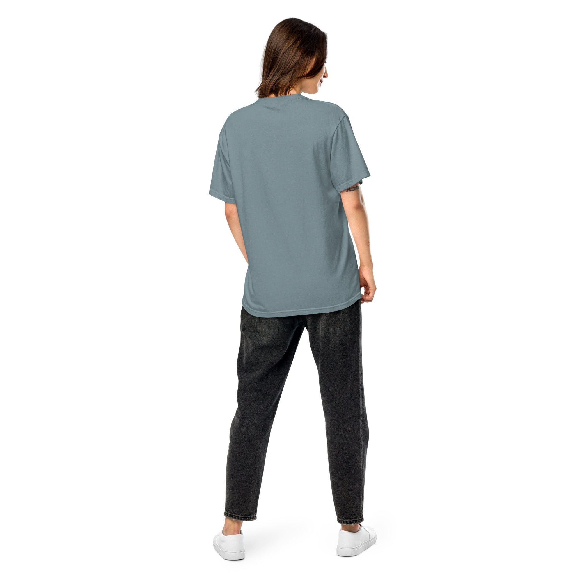 Woman wearing Ukrainian Vibe Trizub Collection garment-dyed heavyweight t-shirt. Back view of relaxed fit, 100% cotton tee.