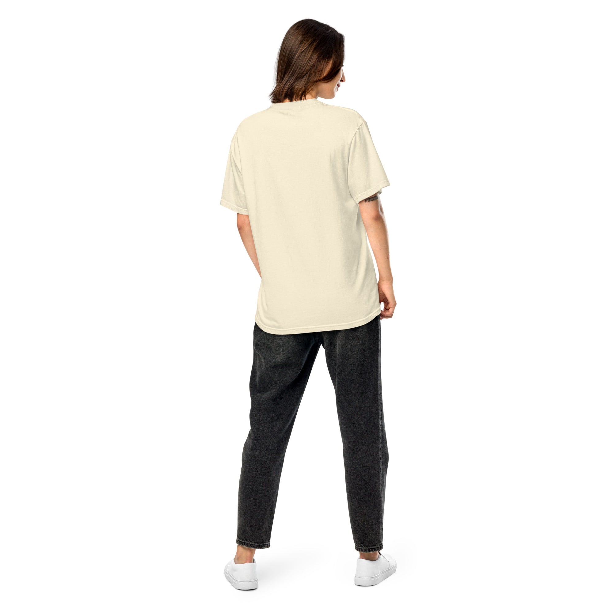 Woman wearing Ukrainian Vibe Trizub Collection heavyweight t-shirt, showcasing a casual fit and garment-dyed finish.
