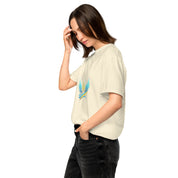 Woman wearing Ukrainian Vibe Trizub Collection heavyweight t-shirt, relaxed fit, side view.