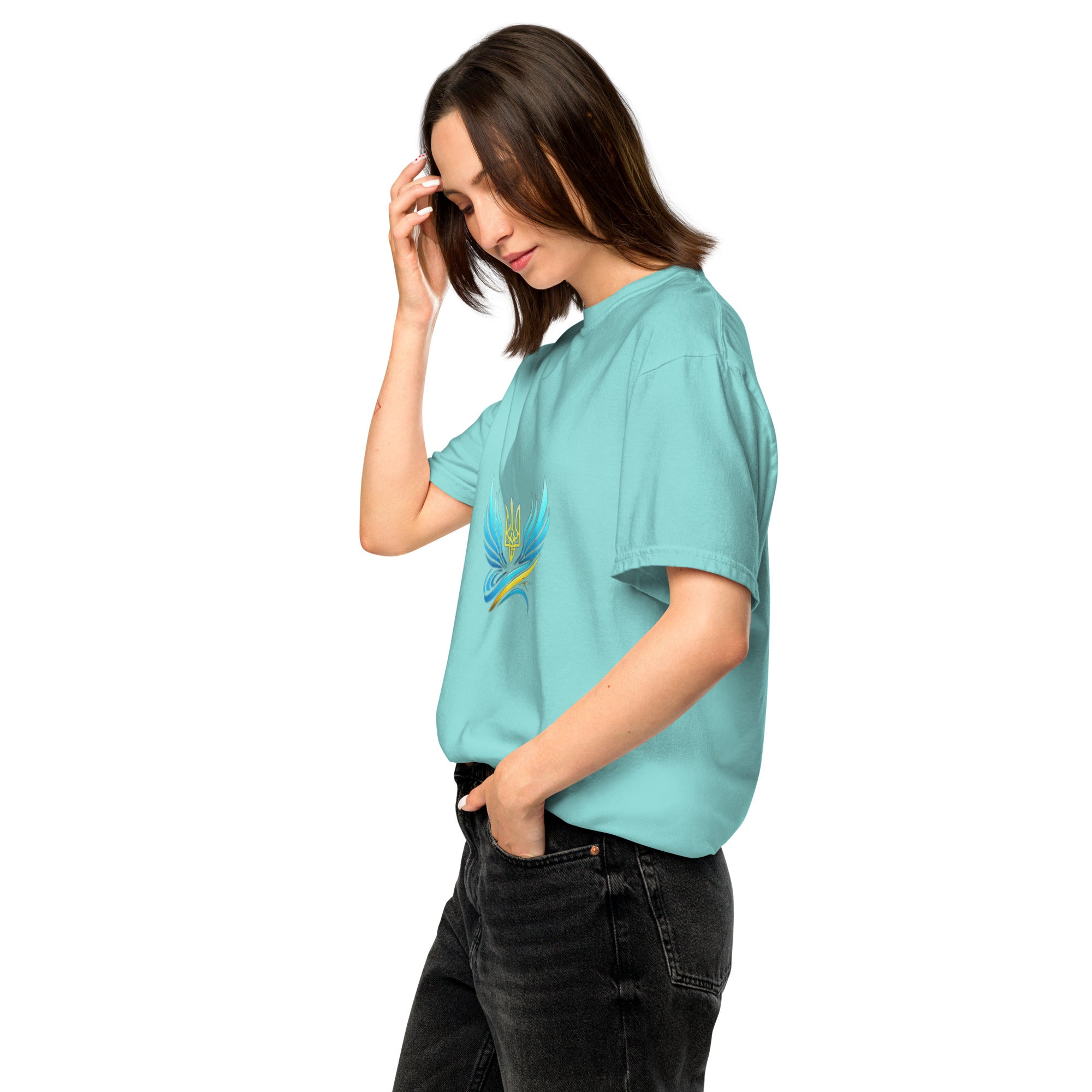 Woman wearing Ukrainian Vibe Trizub Collection garment-dyed heavyweight t-shirt in teal, side view