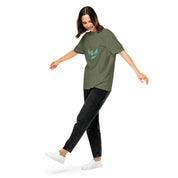 Woman wearing Ukrainian Vibe Trizub Collection heavyweight t-shirt with embroidered design, casual style.