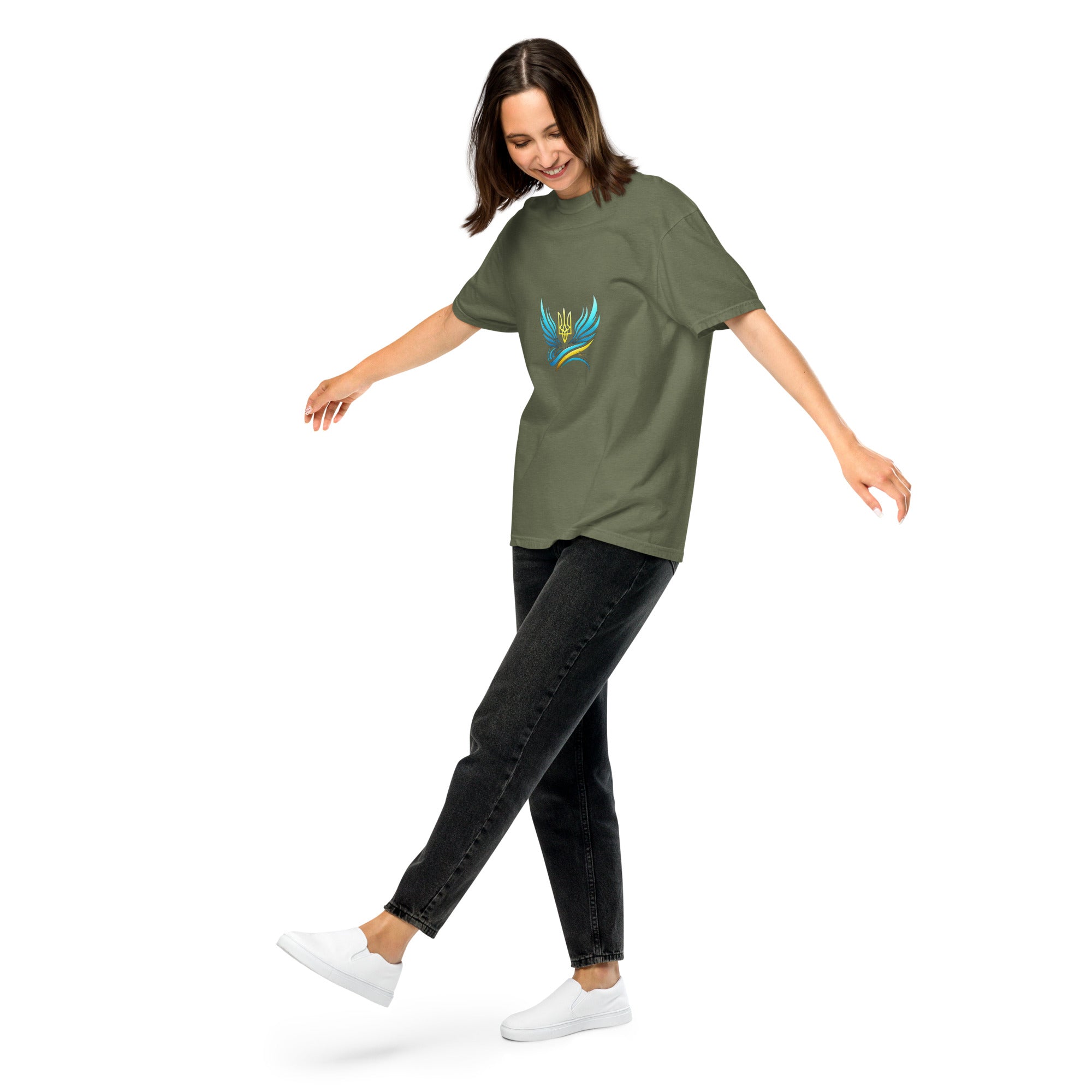 Woman wearing Ukrainian Vibe Trizub Collection heavyweight t-shirt with embroidered design, casual style.