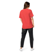 Back view of woman wearing Ukrainian Vibe Trizub Collection red garment-dyed heavyweight t-shirt with relaxed fit and breathable cotton fabric.