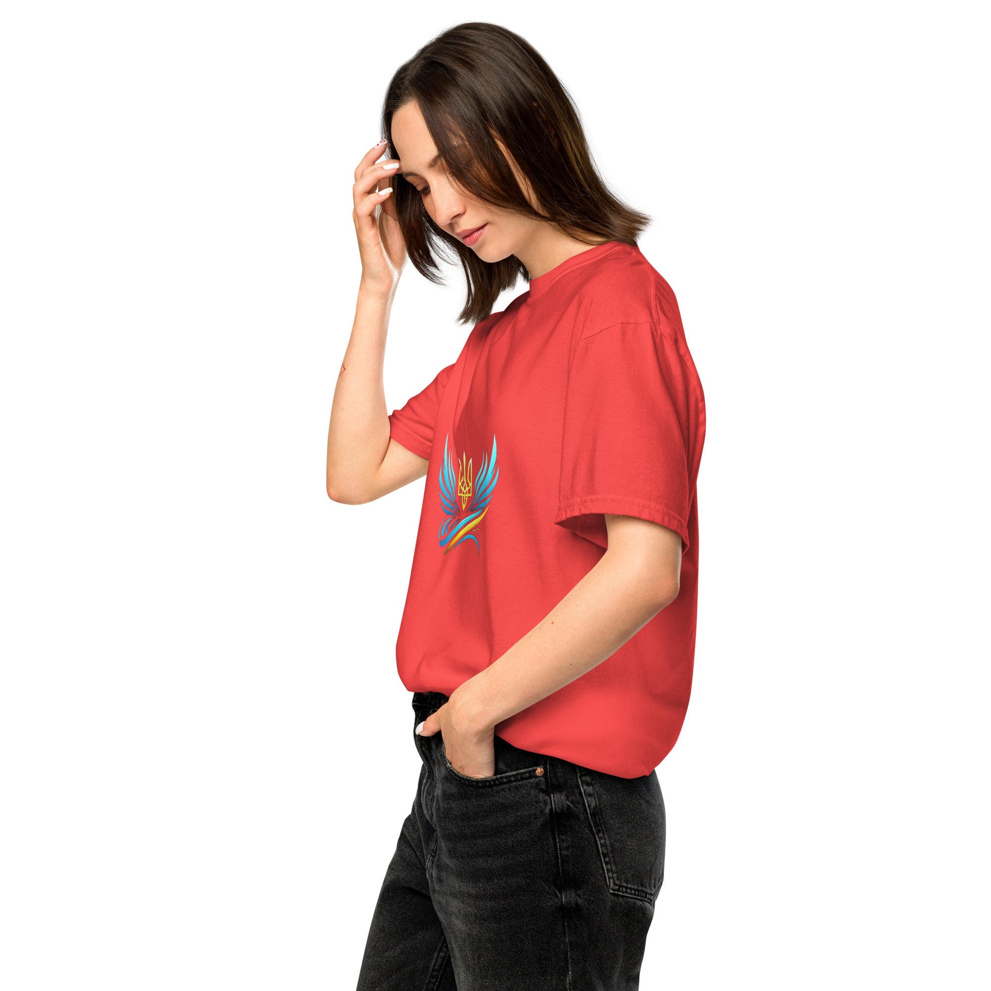 Woman wearing red Ukrainian Vibe Trizub Collection heavyweight t-shirt with blue crest design, casual relaxed fit.
