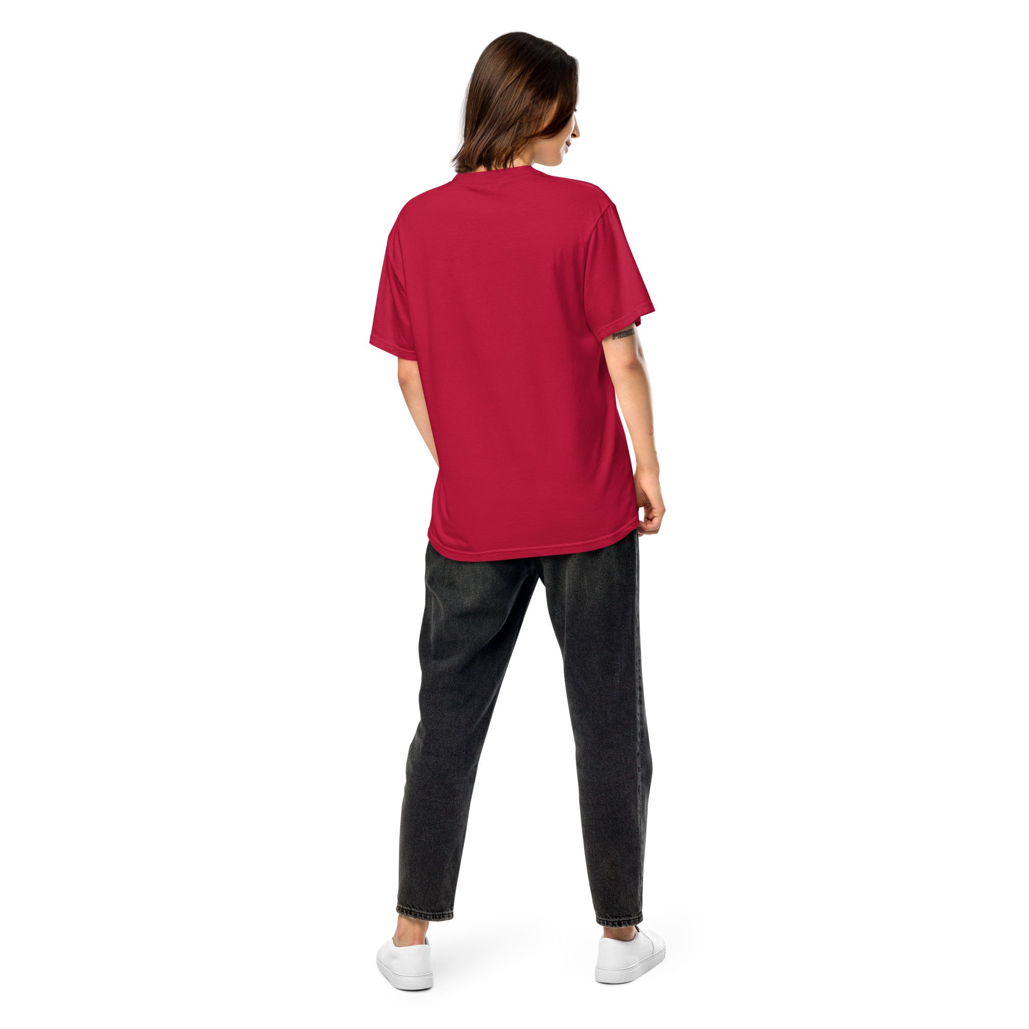 Woman wearing a red Ukrainian Vibe Trizub Collection heavyweight t-shirt, back view showcasing relaxed fit and garment-dyed finish.