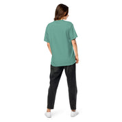 Back view of model wearing green Ukrainian Vibe Trizub Collection women's garment-dyed heavyweight t-shirt with relaxed fit.