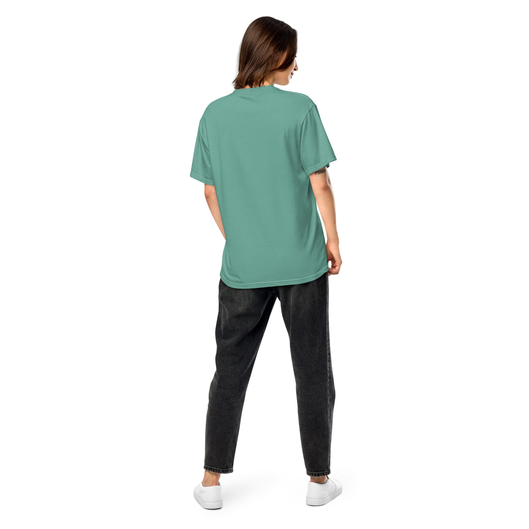 Back view of model wearing green Ukrainian Vibe Trizub Collection women's garment-dyed heavyweight t-shirt with relaxed fit.
