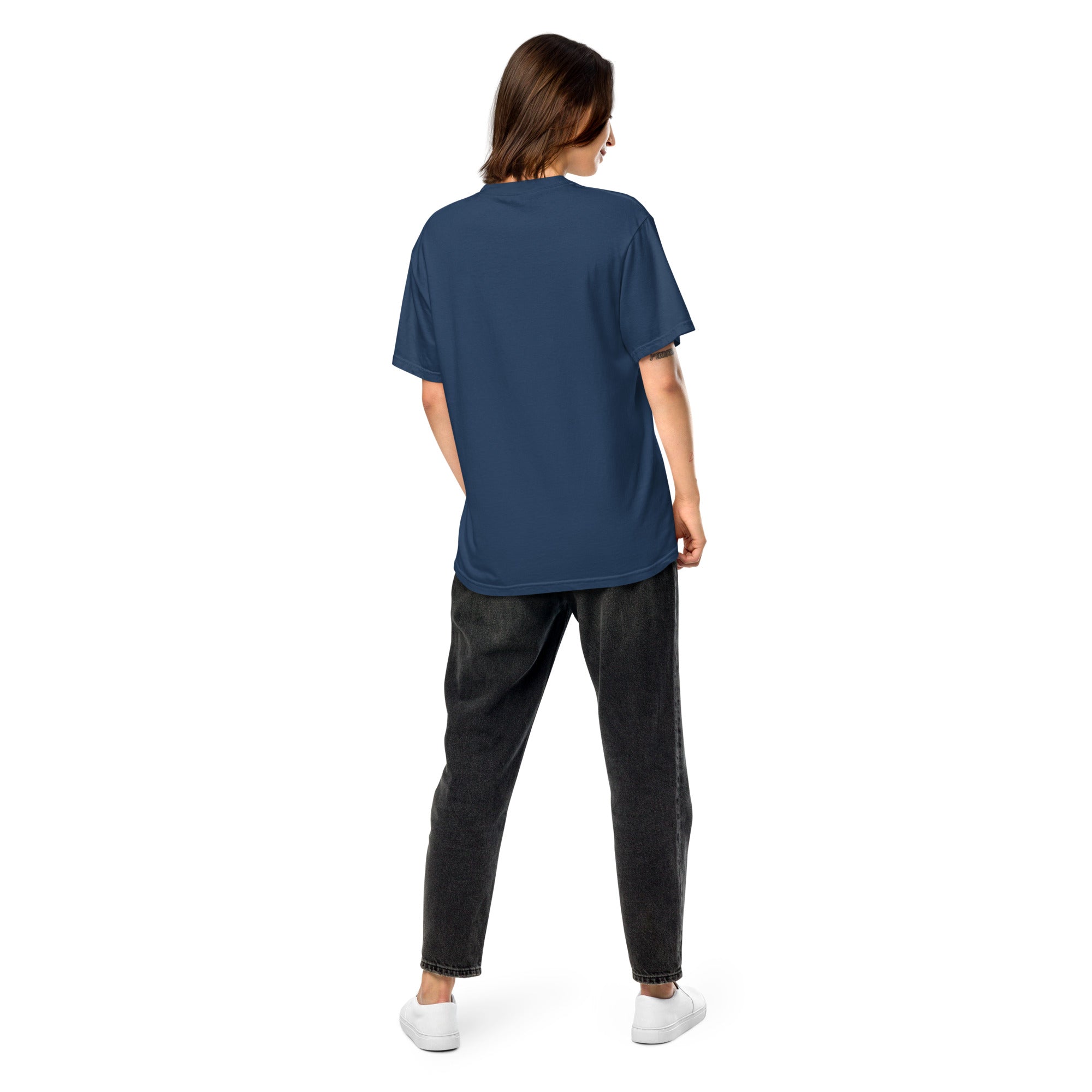 Model wearing Ukrainian Vibe Trizub Collection women's heavyweight blue t-shirt, back view showcasing loose fit and garment-dyed texture.