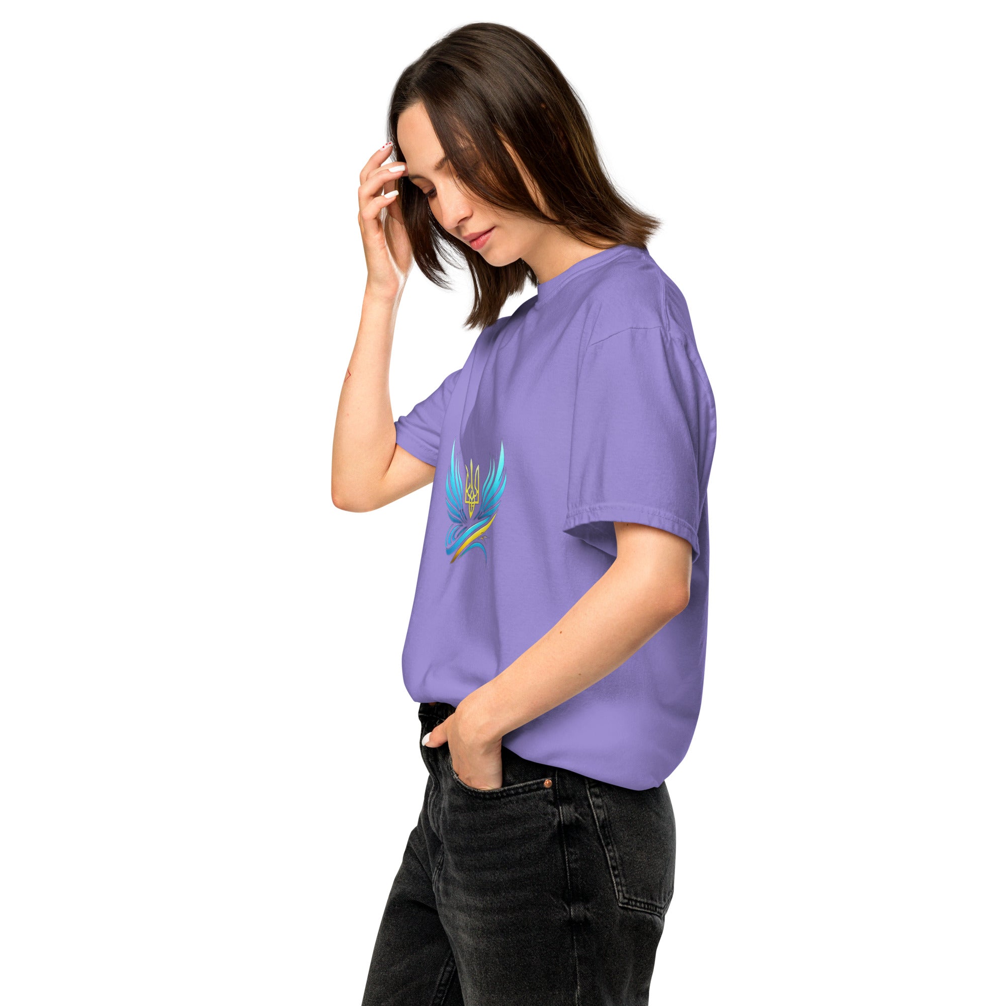 Woman wearing Ukrainian Vibe Trizub Collection garment-dyed heavyweight t-shirt in purple, displaying Trizub emblem.
