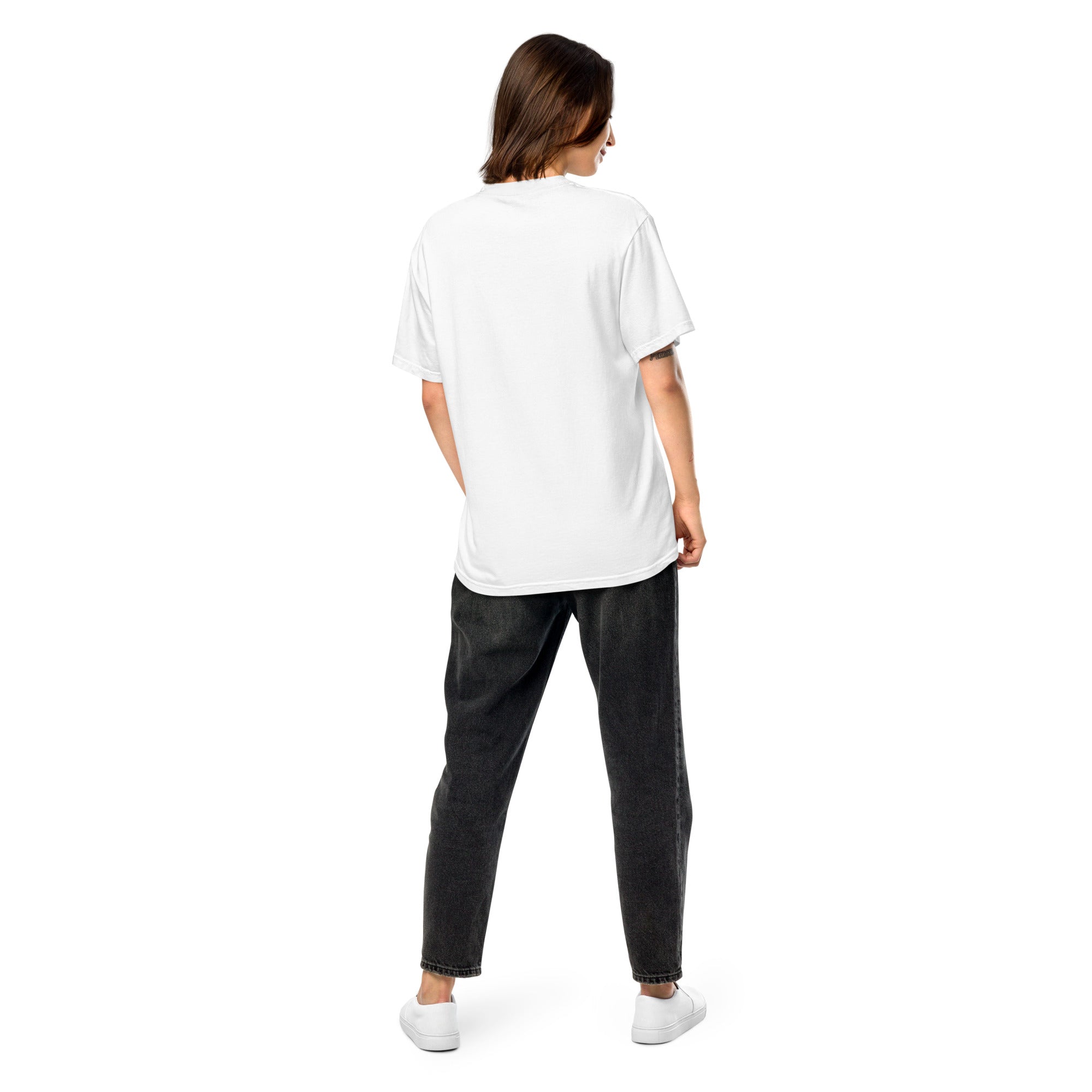 Back view of a woman wearing a white Ukrainian Vibe Trizub Collection garment-dyed heavyweight t-shirt with black jeans.