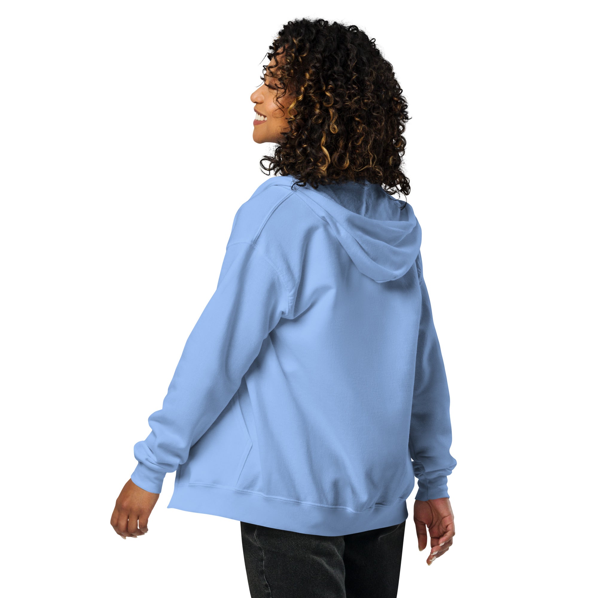 Woman wearing light blue heavy blend zip hoodie, showing back view and hood detailing.